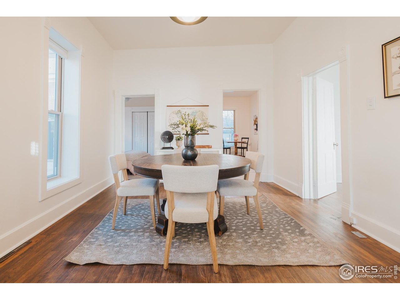 506 South Howes Street Fort Collins, CO 80521 - Photo 12 of 37 a dining room with furniture a rug and wooden floor