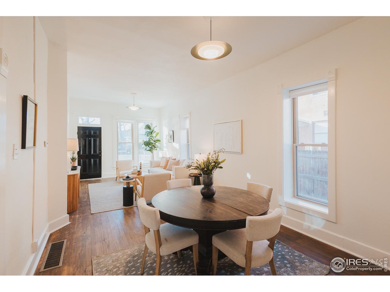 506 South Howes Street Fort Collins, CO 80521 - Photo 13 of 37 a view of a dining room with furniture and wooden floor