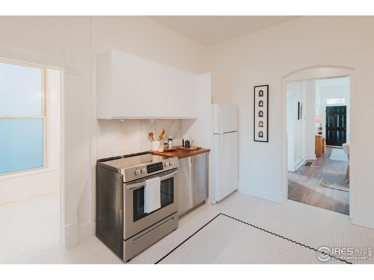 506 South Howes Street Fort Collins, CO 80521 - Photo 17 of 37 a kitchen with a stove top oven and cabinets