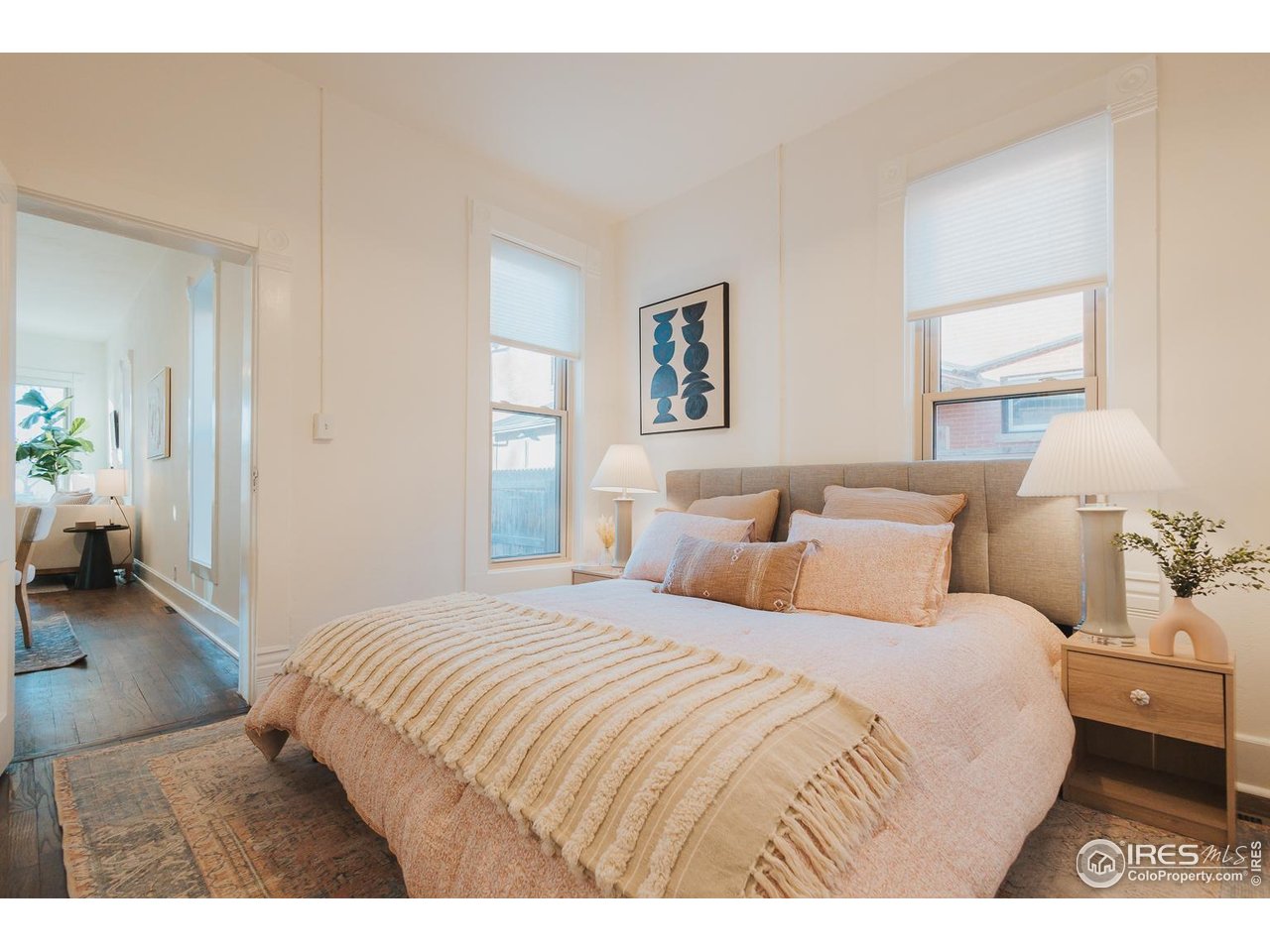 506 South Howes Street Fort Collins, CO 80521 - Photo 23 of 37 a bedroom with a bed and a couch