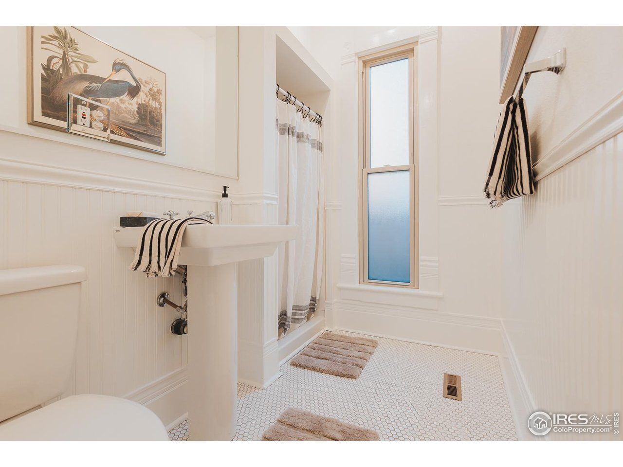 506 South Howes Street Fort Collins, CO 80521 - Photo 27 of 37 a white bath tub sitting next to a white wall