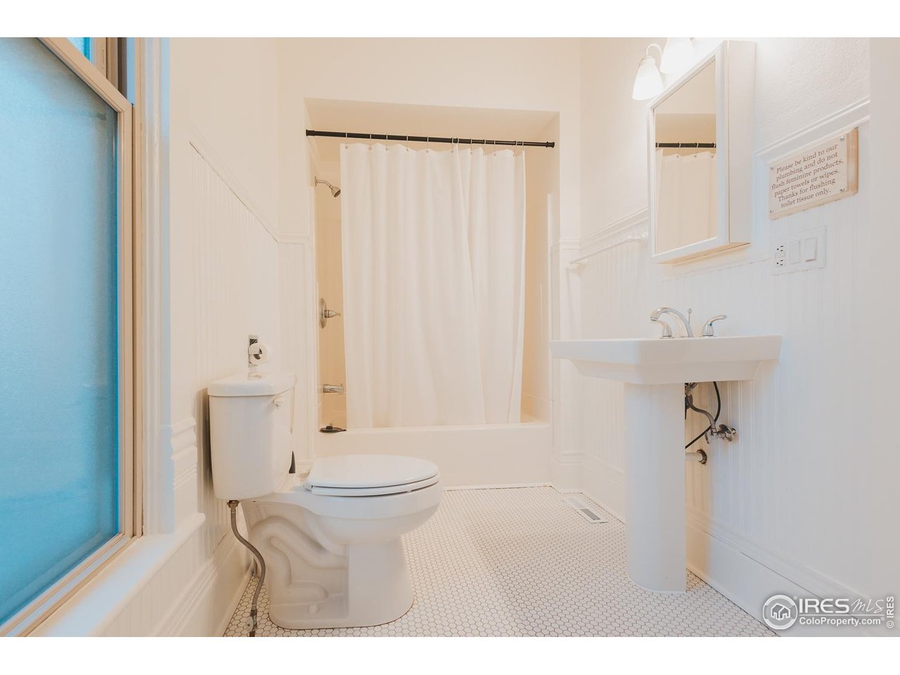 506 South Howes Street Fort Collins, CO 80521 - Photo 30 of 37 a bathroom with a sink a toilet and shower