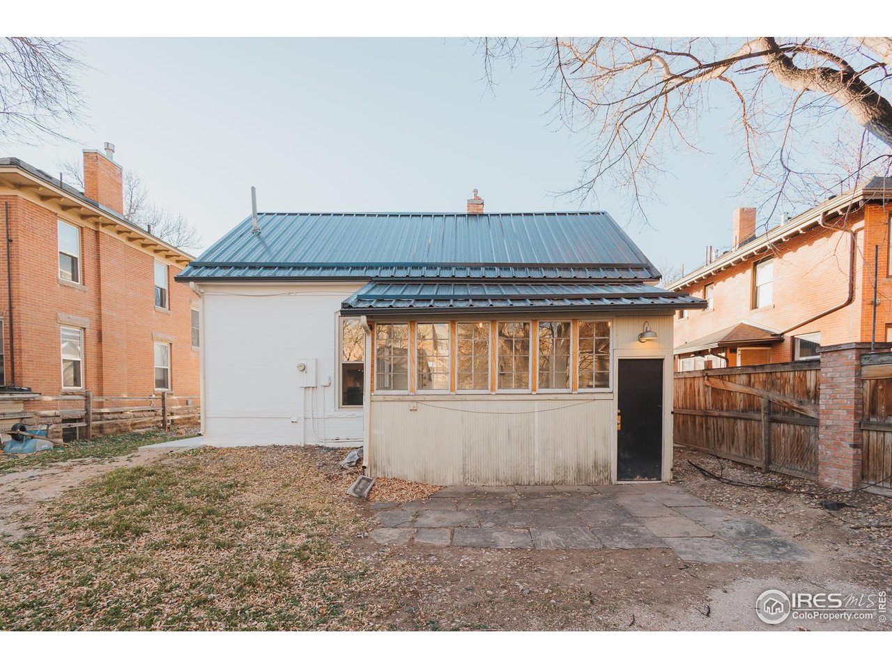 506 South Howes Street Fort Collins, CO 80521 - Photo 35 of 37 a view of house with backyard and trees