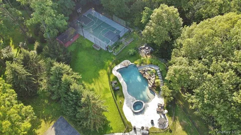 an aerial view of residential building and green space