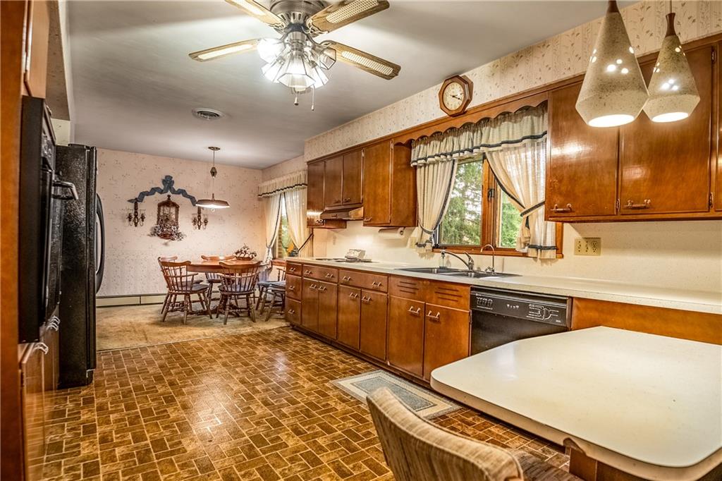 519 North Hermitage Road Hermitage, PA 16148 - Photo 17 of 38 a large kitchen with a table and chairs in it