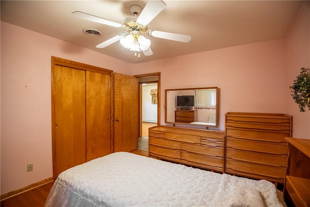 519 North Hermitage Road Hermitage, PA 16148 - Photo 23 of 38 a bedroom with a bed and a chandelier