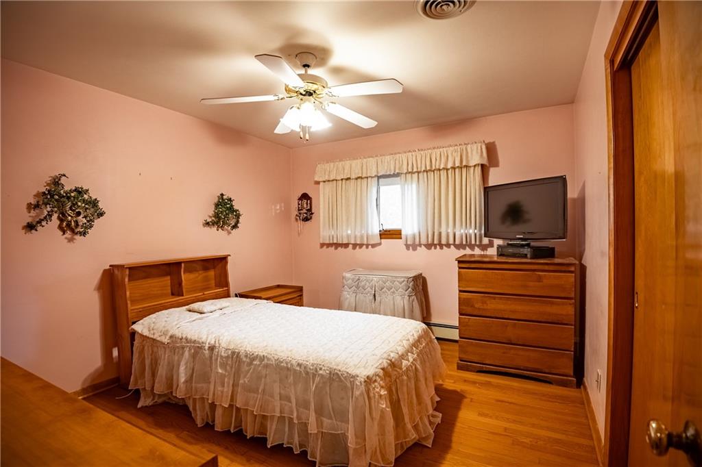 519 North Hermitage Road Hermitage, PA 16148 - Photo 26 of 38 a bedroom with a bed and a chandelier