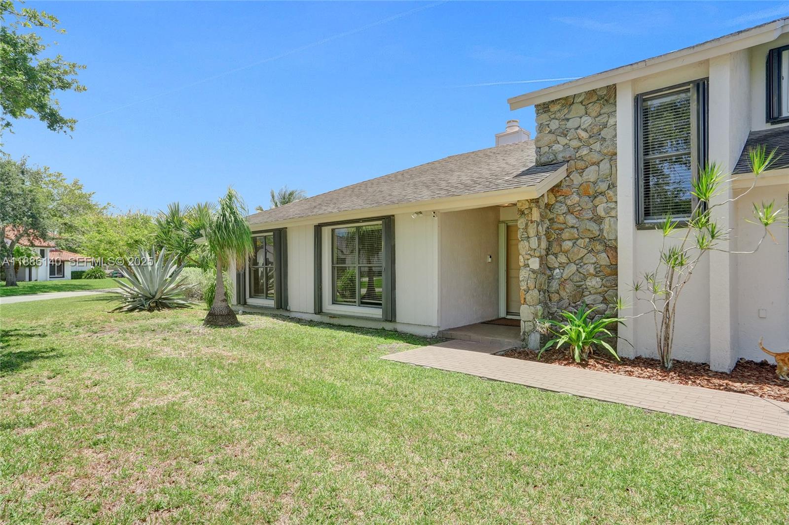 14940 Southwest 164th Terrace Miami, FL 33187 - Photo 16 of 73 a view of a house with backyard and garden
