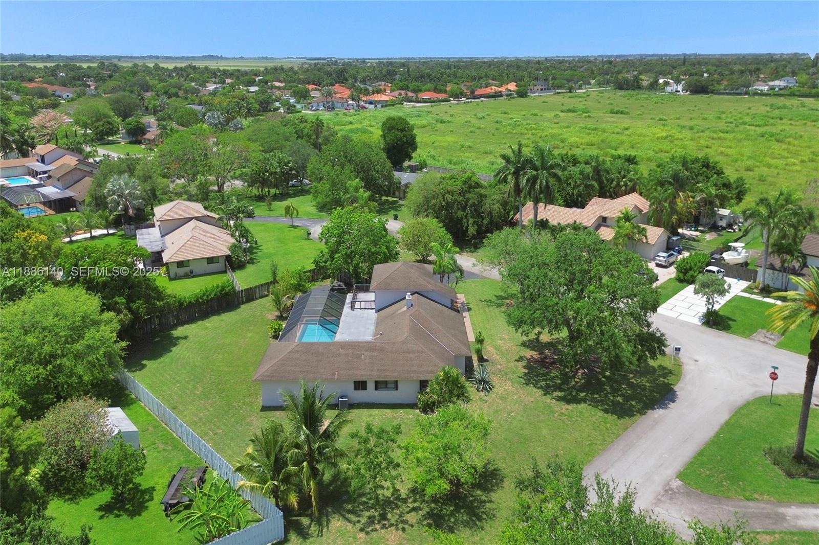14940 Southwest 164th Terrace Miami, FL 33187 - Photo 2 of 73 an aerial view of a house with yard
