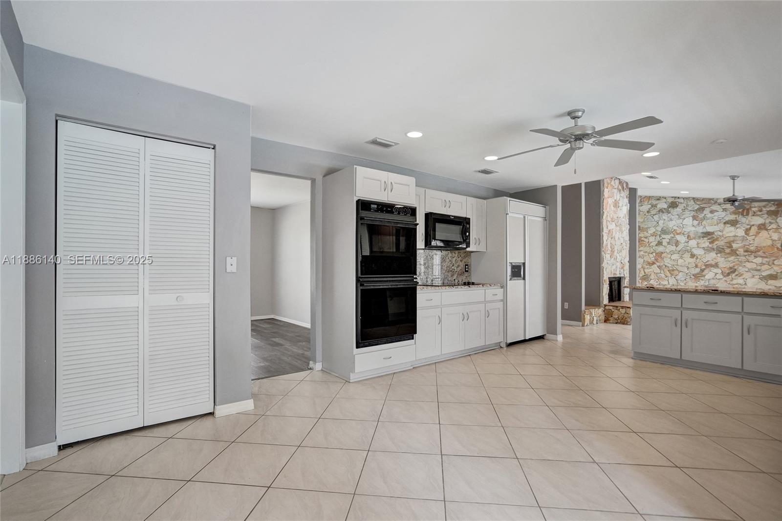 14940 Southwest 164th Terrace Miami, FL 33187 - Photo 30 of 73 a view of a kitchen with a sink and cabinet window