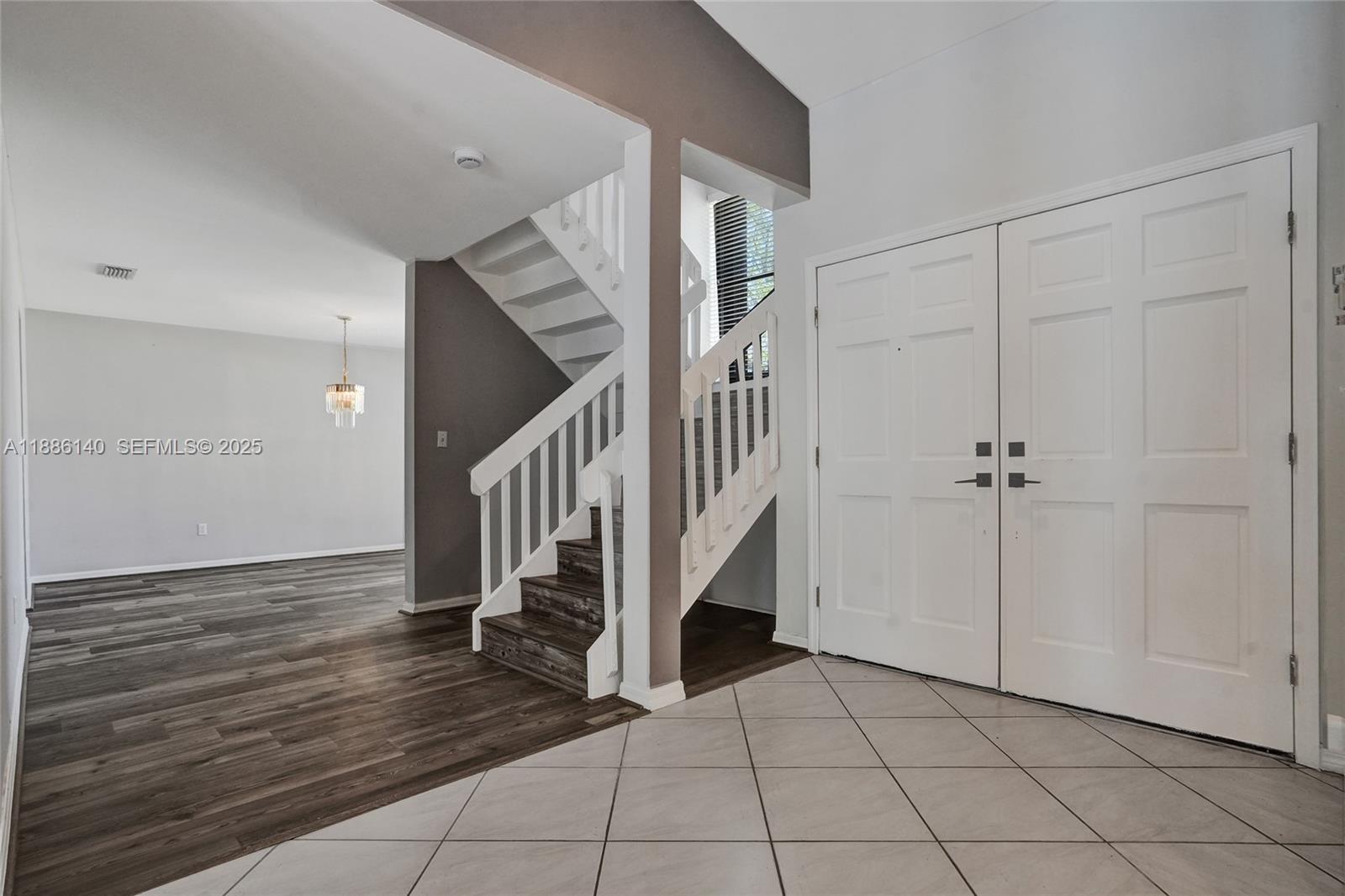 14940 Southwest 164th Terrace Miami, FL 33187 - Photo 34 of 73 a view of entryway and hall with a rug