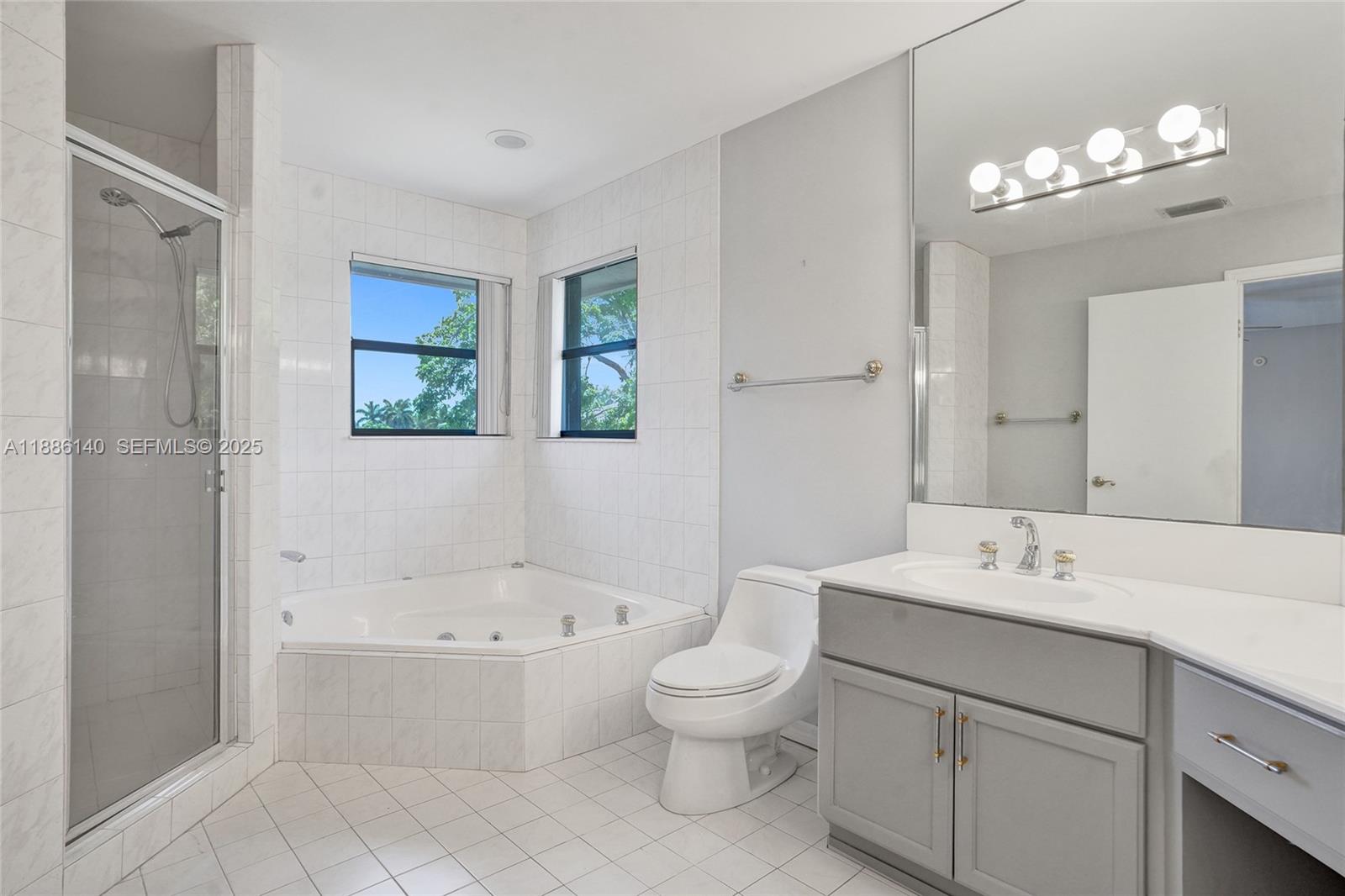 14940 Southwest 164th Terrace Miami, FL 33187 - Photo 39 of 73 a bathroom with a sink a toilet and shower