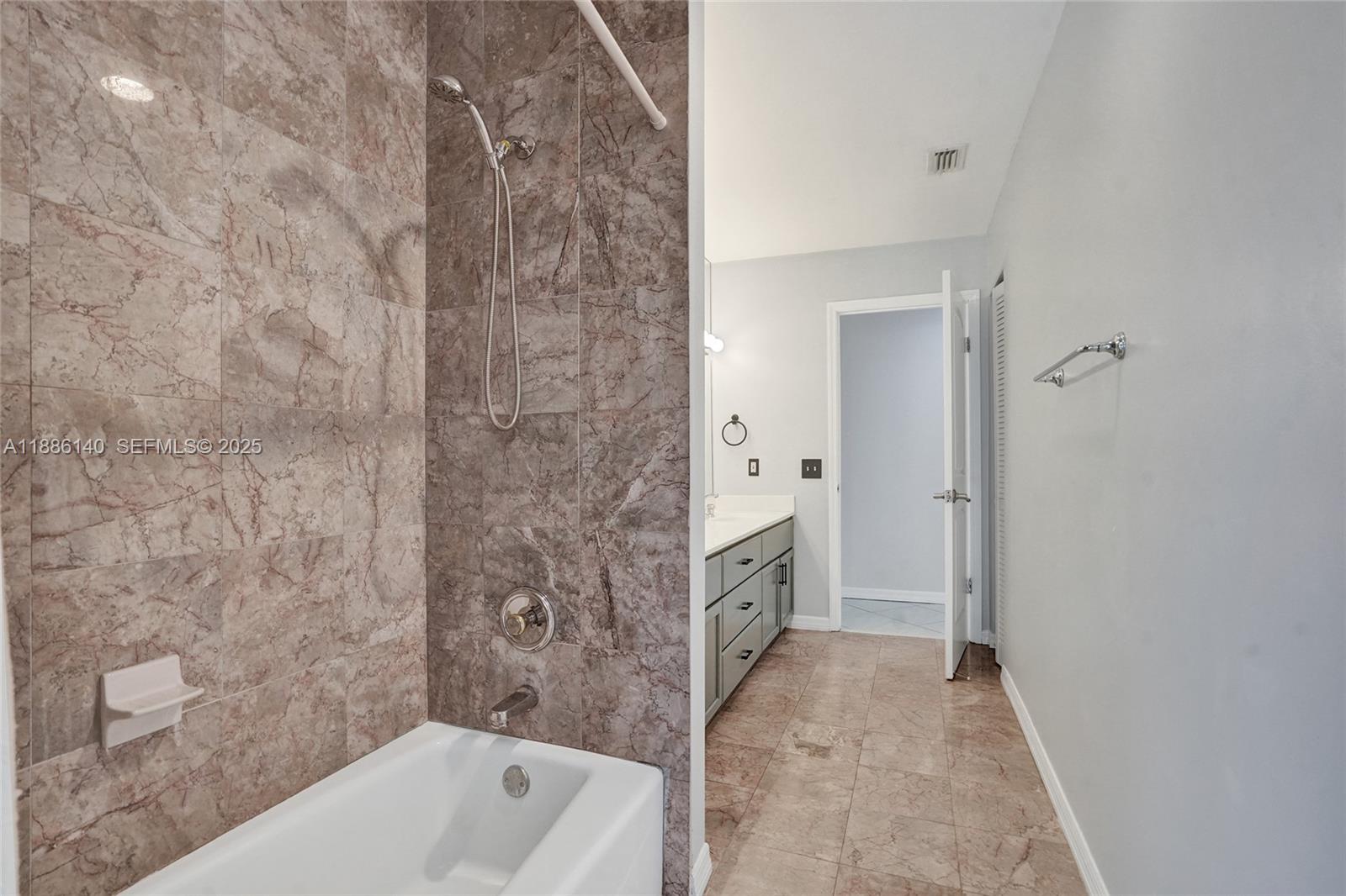 14940 Southwest 164th Terrace Miami, FL 33187 - Photo 54 of 73 a bathroom with a sink a toilet and shower