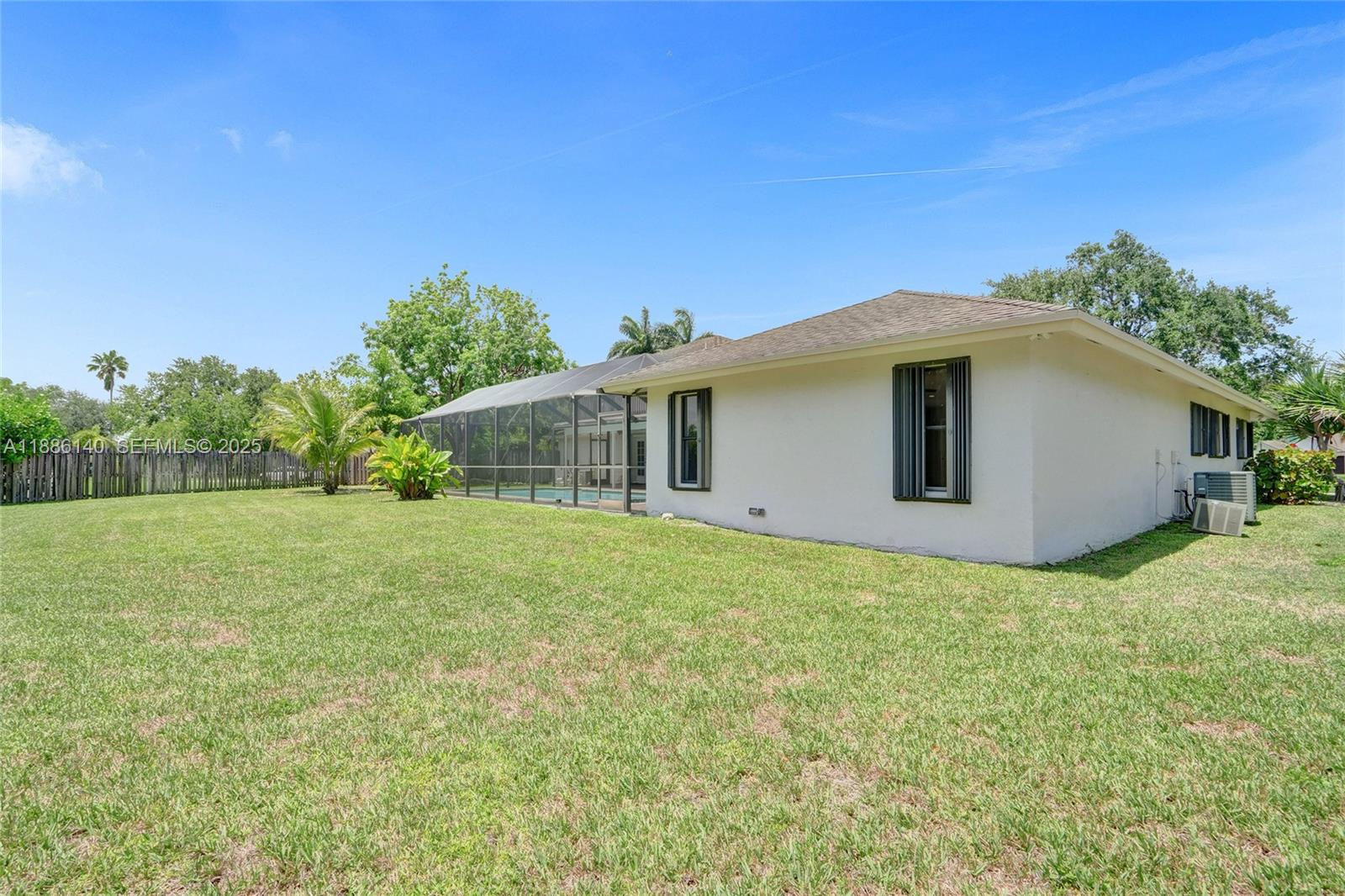 14940 Southwest 164th Terrace Miami, FL 33187 - Photo 57 of 73 a yellow house with a garden
