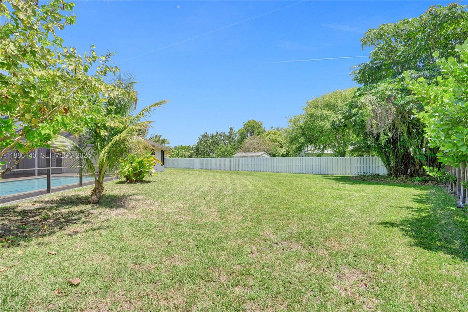 14940 Southwest 164th Terrace Miami, FL 33187 - Photo 61 of 73 a view of a yard with a tree