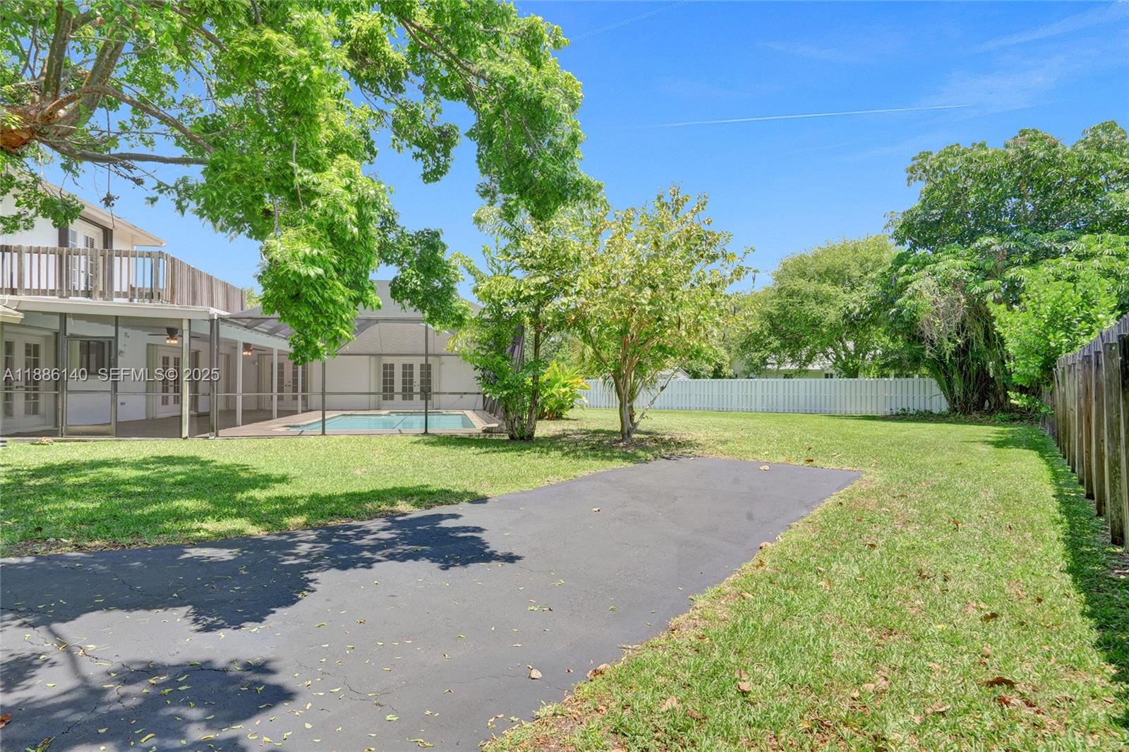 14940 Southwest 164th Terrace Miami, FL 33187 - Photo 62 of 73 a view of a house with a park