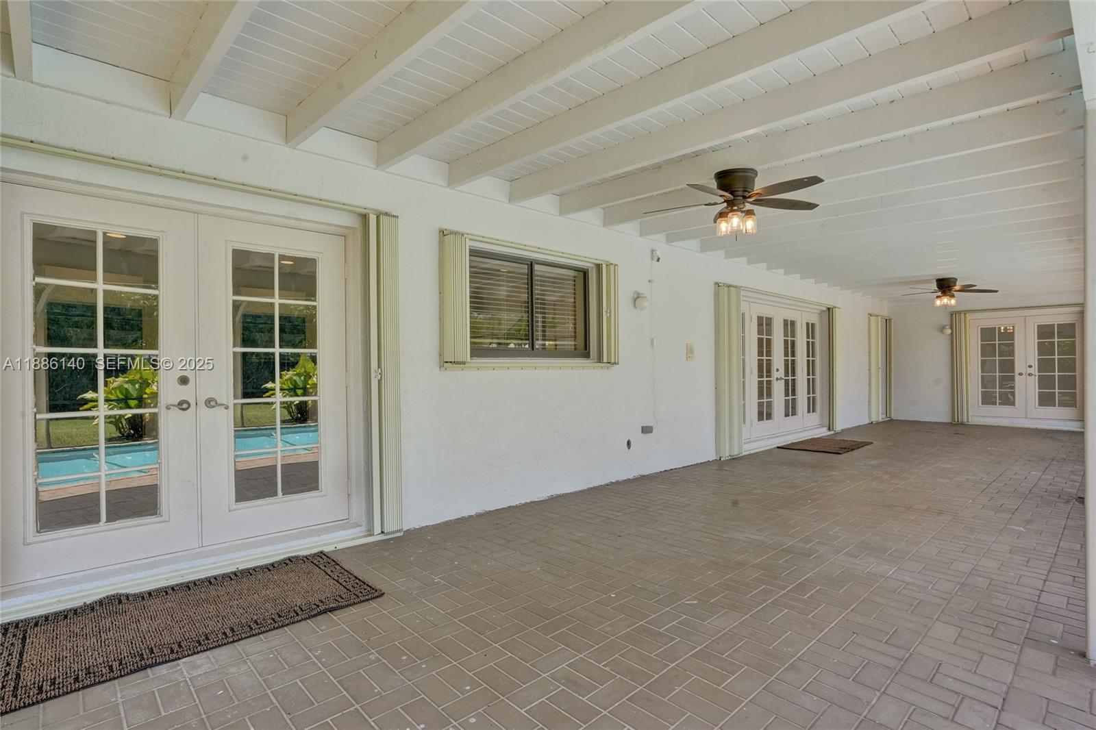 14940 Southwest 164th Terrace Miami, FL 33187 - Photo 64 of 73 a view of an empty room with a window