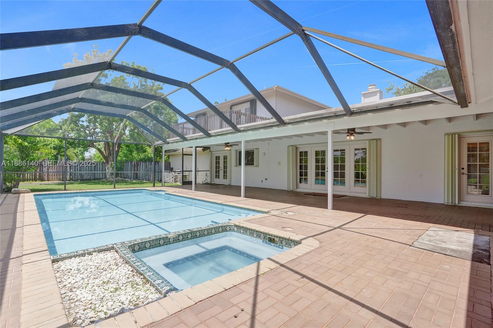 14940 Southwest 164th Terrace Miami, FL 33187 - Photo 67 of 73 a view of a building with a backyard