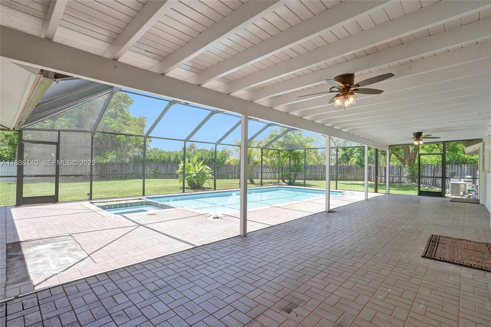 14940 Southwest 164th Terrace Miami, FL 33187 - Photo 69 of 73 a view of an entryway with a tv