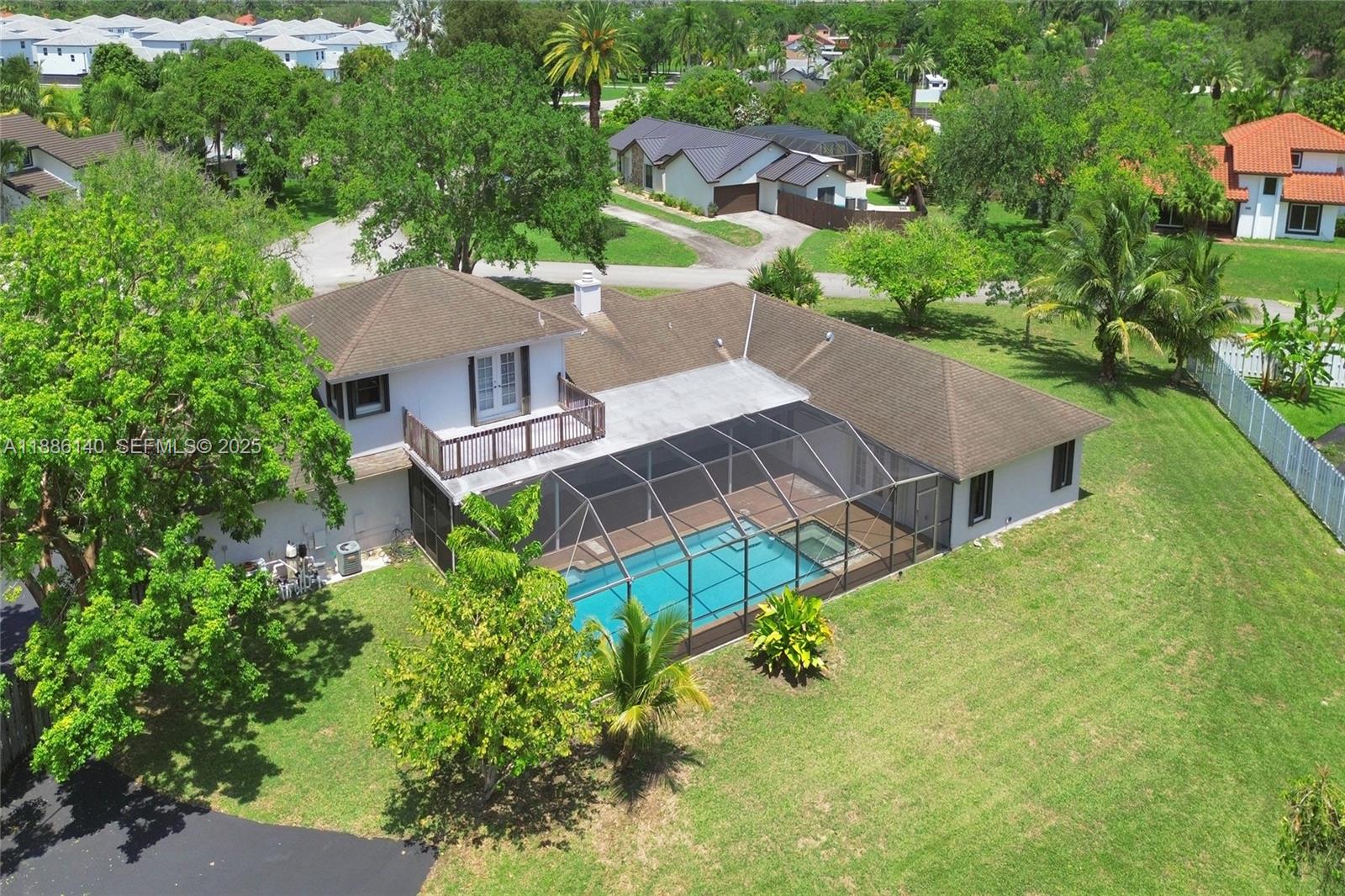 14940 Southwest 164th Terrace Miami, FL 33187 - Photo 8 of 73 an aerial view of a house