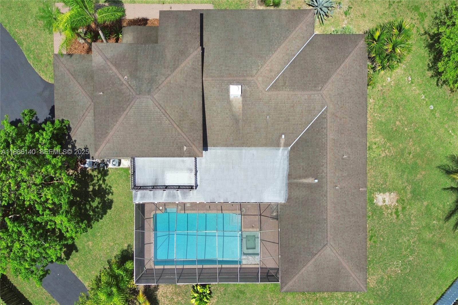 14940 Southwest 164th Terrace Miami, FL 33187 - Photo 9 of 73 an aerial view of a house with a yard