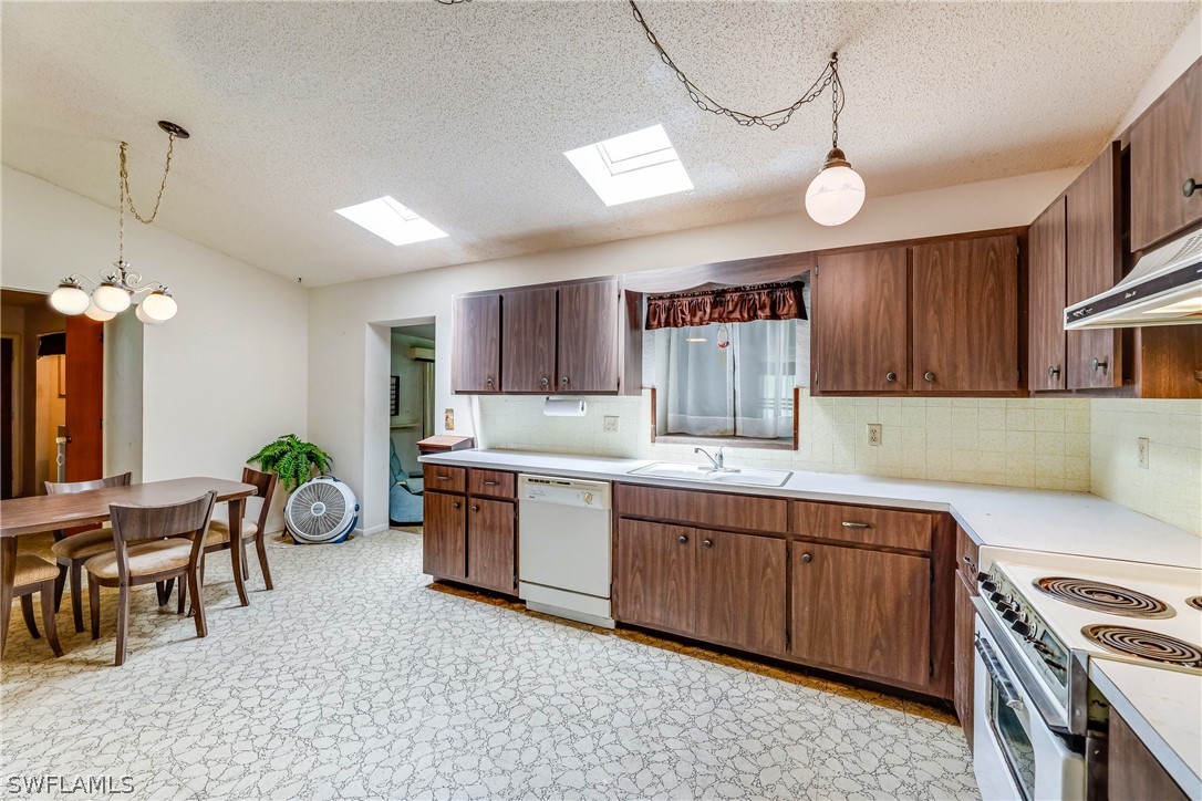 2807 W Road Fort Myers, FL 33905 - Photo 10 of 27 a kitchen with a sink a stove and cabinets