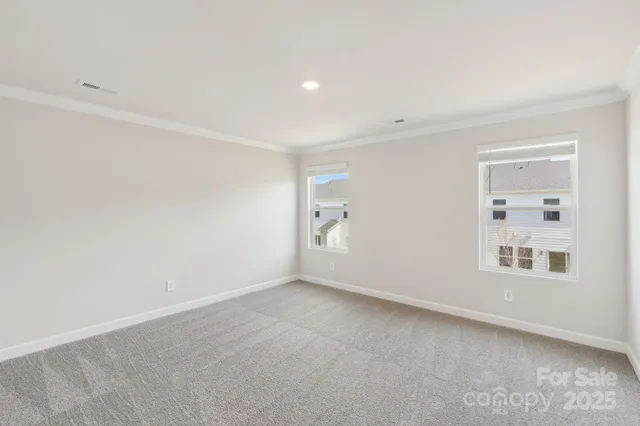 a view of empty room with windows