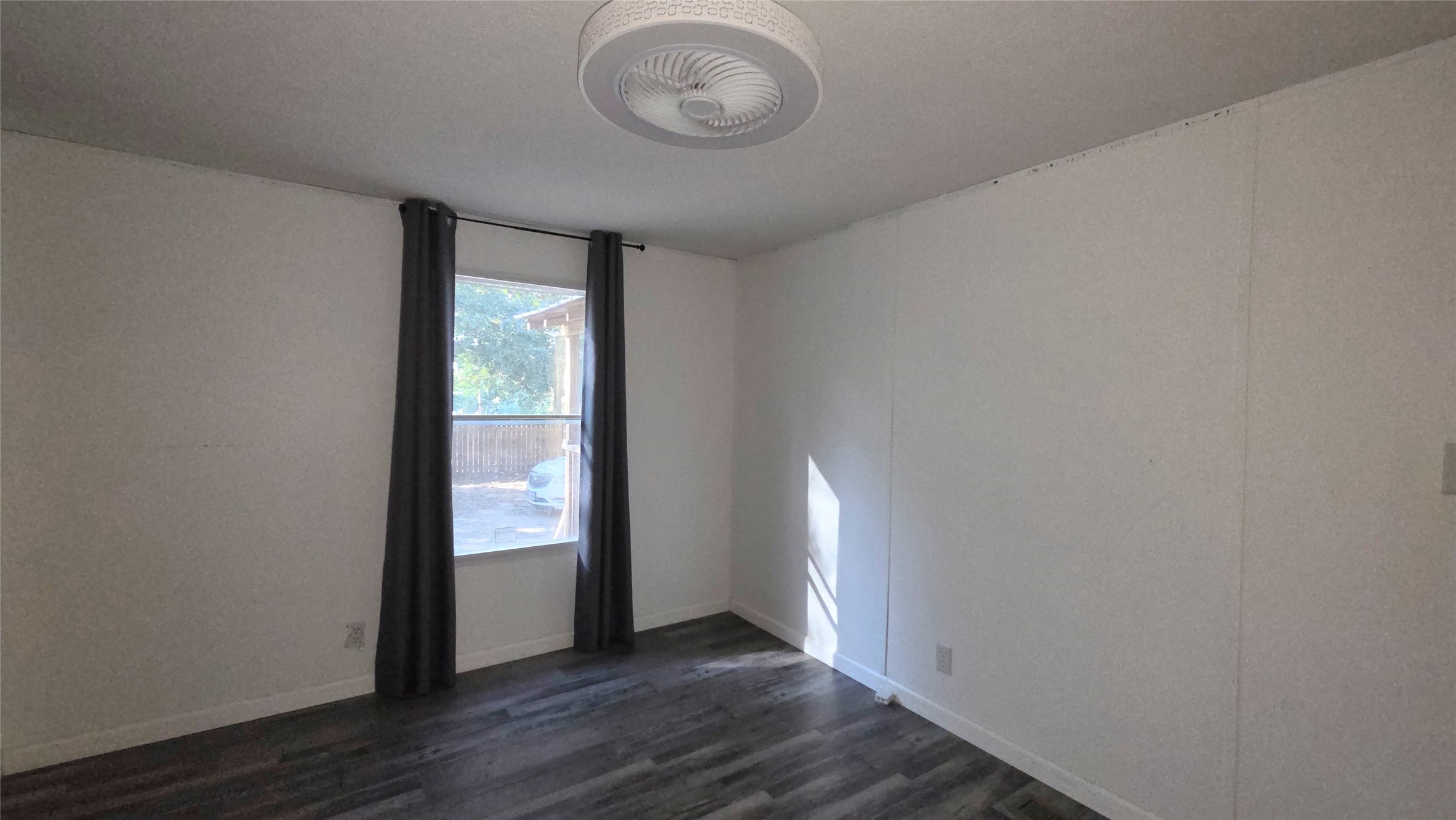 21150 Arnsworth Road Montgomery, TX 77356 - Photo 14 of 16 a view of an empty room with wooden floor and a window
