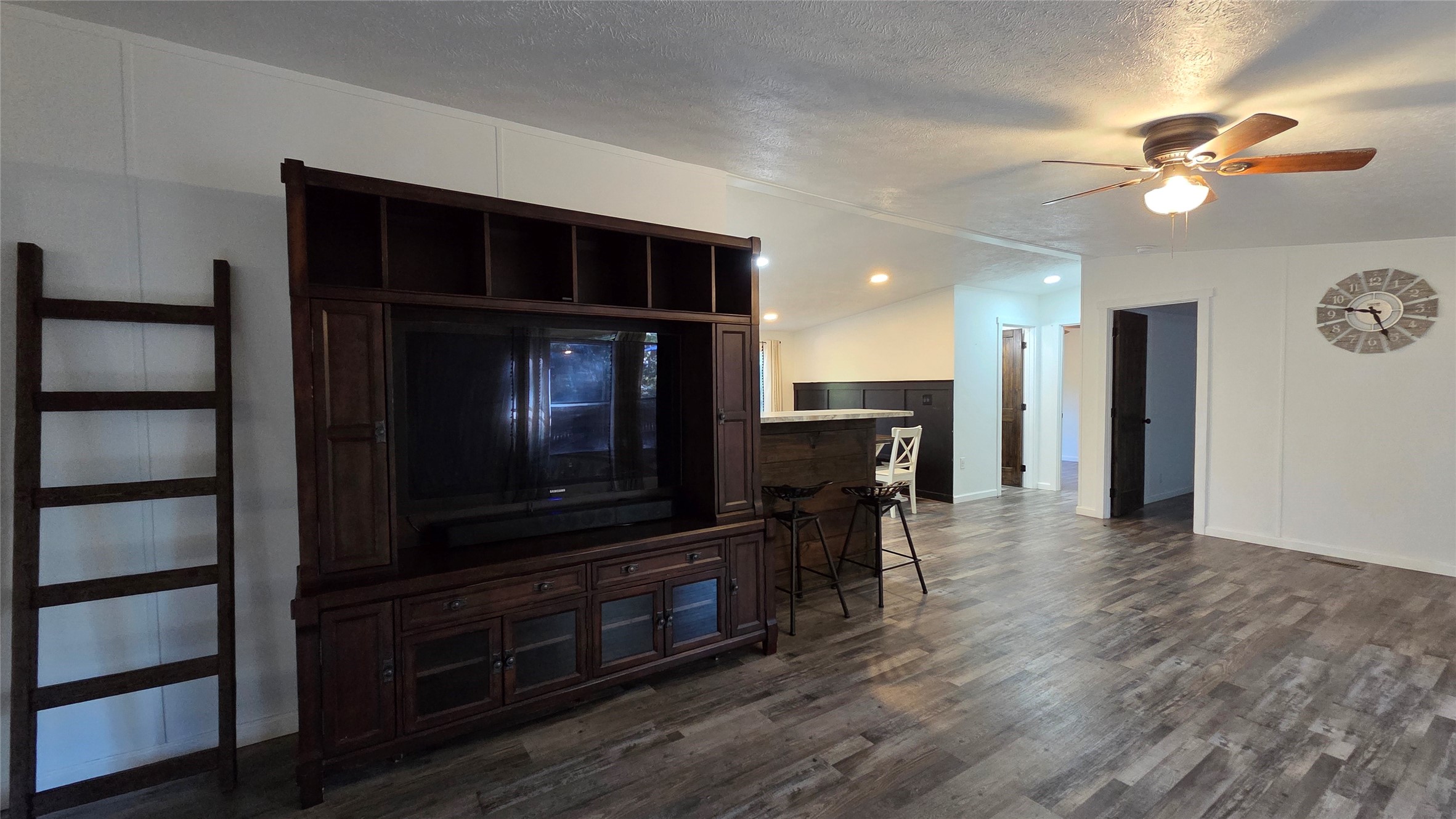 21150 Arnsworth Road Montgomery, TX 77356 - Photo 5 of 16 a view of a livingroom with furniture fan and wooden floor