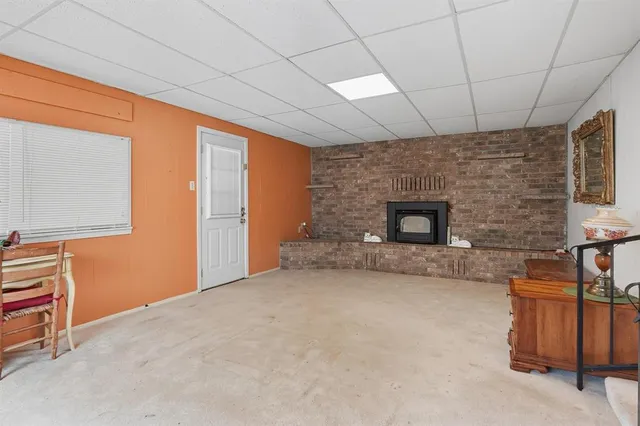 a view of an empty room with a fireplace