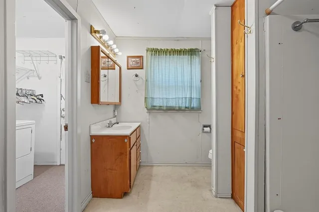 a bathroom with a tub and a shower