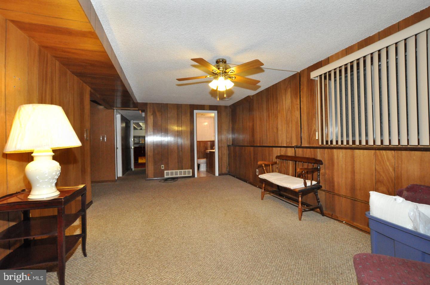 218 Downing Road Somerdale, NJ 08083 - Photo 15 of 28 LOWER LEVEL LIVING ROOM #3 - HALF BATH OFF OF ROOM