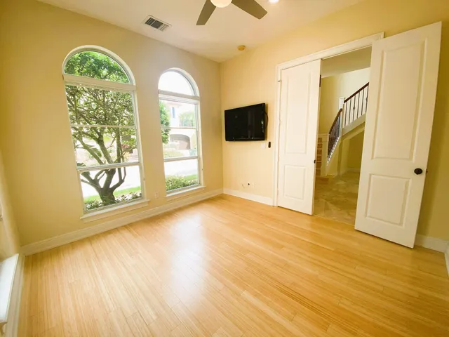 a view of entryway with wooden floor and door