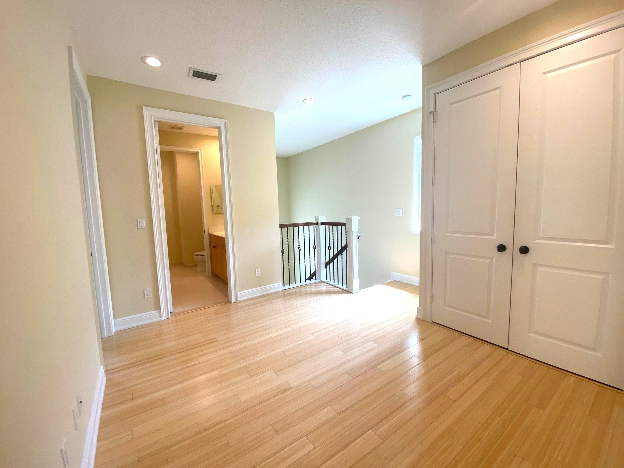 50 Via Poinciana Lane Boca Raton, FL 33487 - Photo 24 of 51 a view of empty room with wooden floor