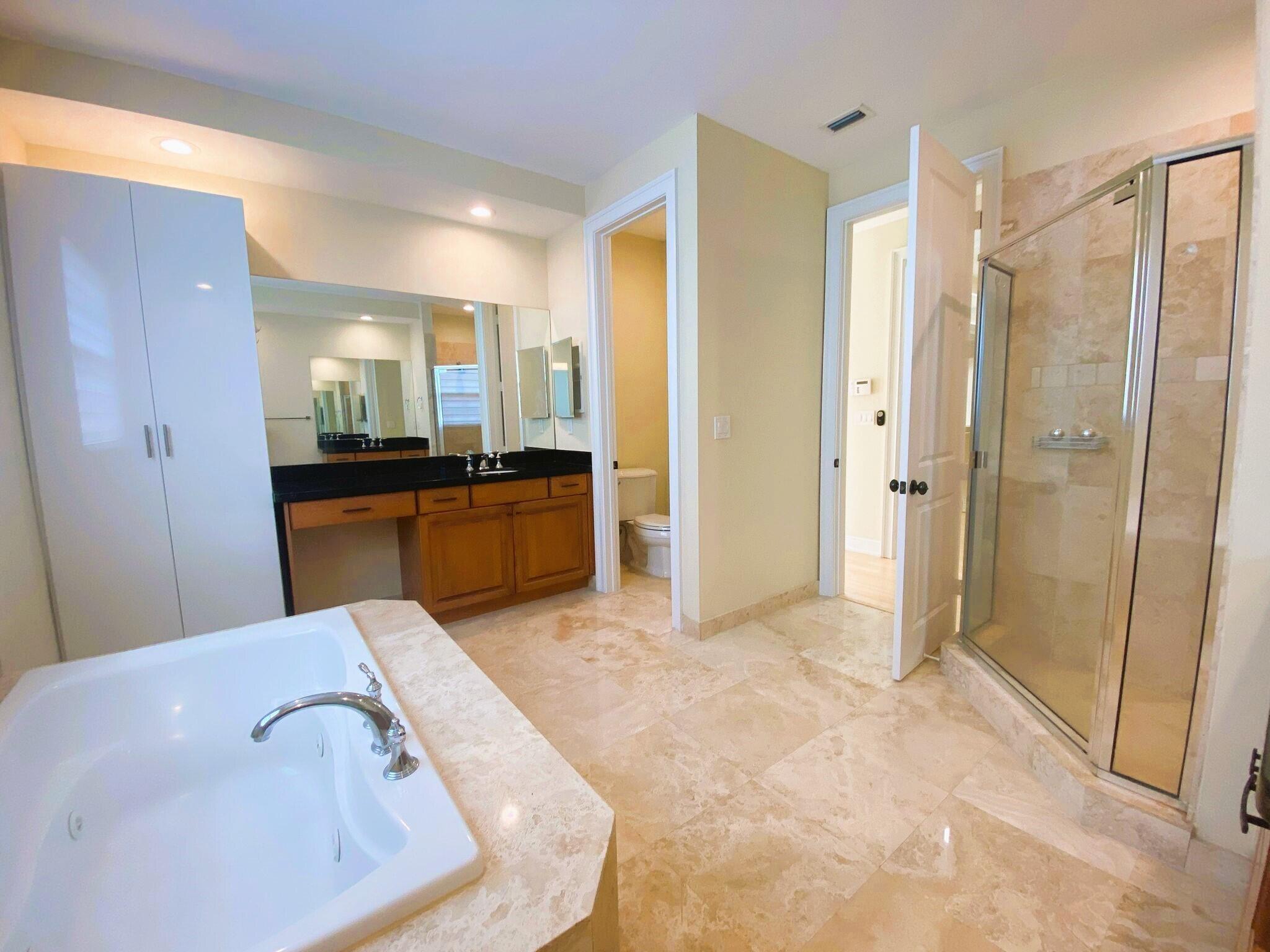 50 Via Poinciana Lane Boca Raton, FL 33487 - Photo 37 of 51 a view of a bathroom from a hallway