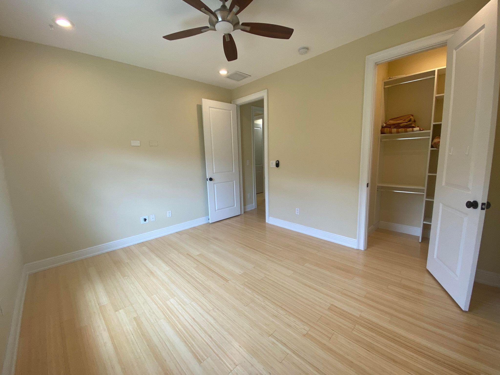 50 Via Poinciana Lane Boca Raton, FL 33487 - Photo 39 of 51 a view of an empty room and wooden floor