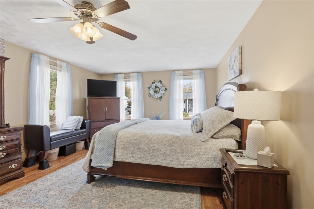 18 Trifiro Road Billerica, MA 01821 - Photo 25 of 42 a bedroom with a bed and a chandelier