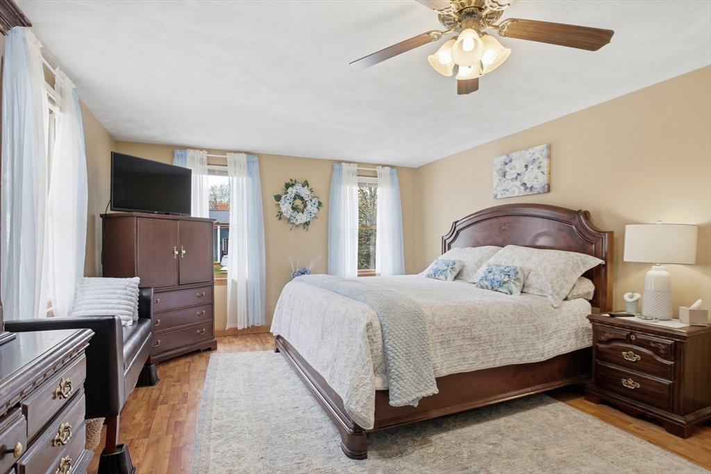 18 Trifiro Road Billerica, MA 01821 - Photo 26 of 42 a bedroom with a bed and a flat tv screen on dresser