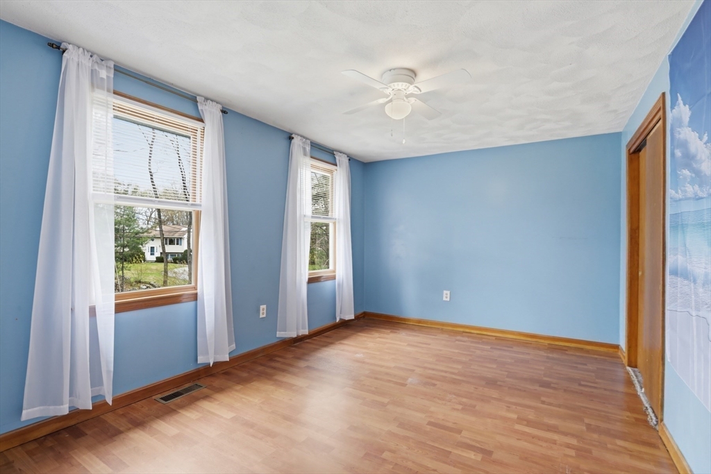 18 Trifiro Road Billerica, MA 01821 - Photo 30 of 42 a view of an empty room with window and wooden floor
