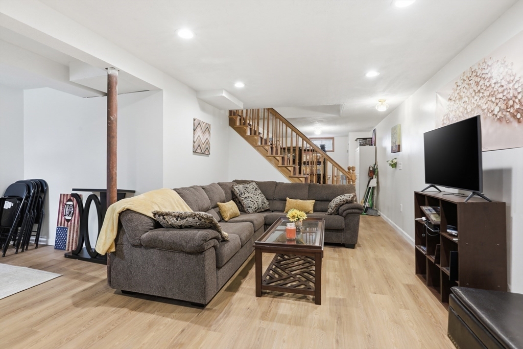 18 Trifiro Road Billerica, MA 01821 - Photo 33 of 42 a living room with furniture and a flat screen tv