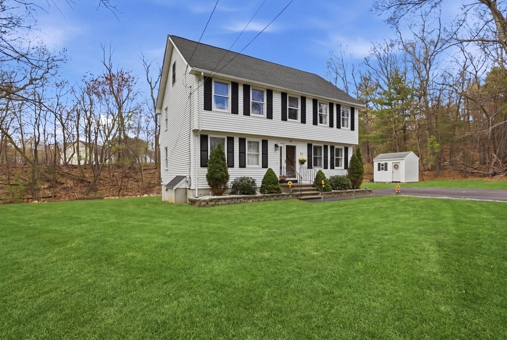 18 Trifiro Road Billerica, MA 01821 - Photo 4 of 42 a front view of house with yard and outdoor seating