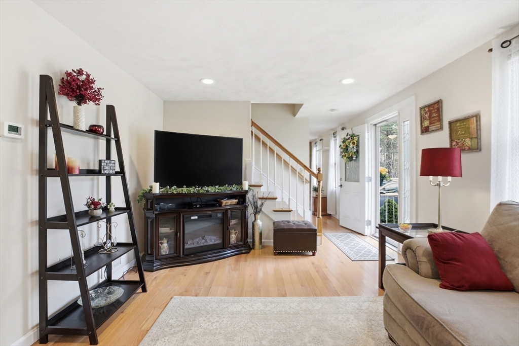 18 Trifiro Road Billerica, MA 01821 - Photo 6 of 42 a living room with furniture and a flat screen tv