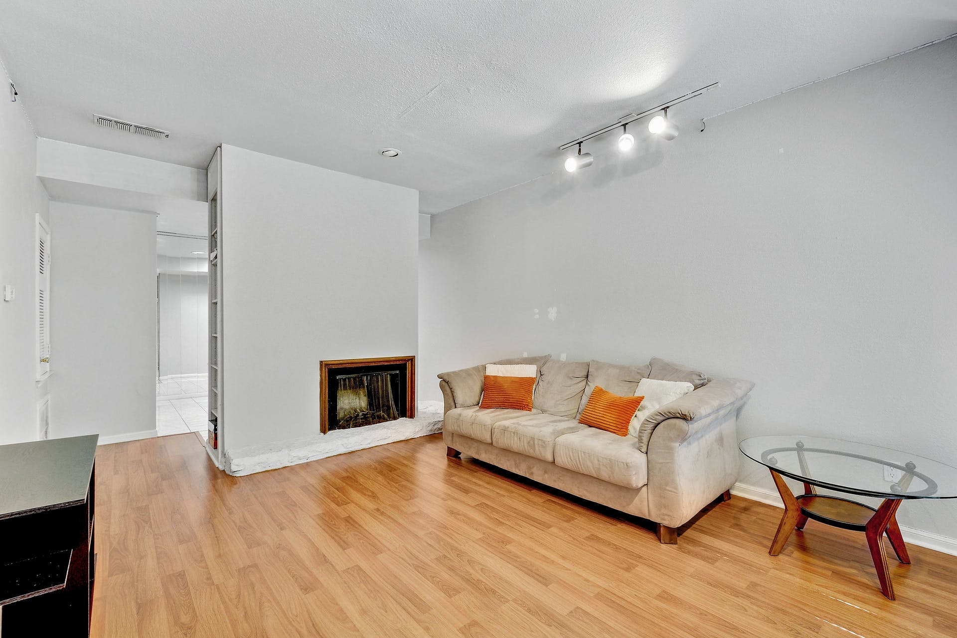 2529 Rio Grande Street, Unit 12 Austin, TX 78705 - Photo 2 of 25 Feel right at home with the inviting living room featuring warm woodlike laminate floors and cozy fireplace