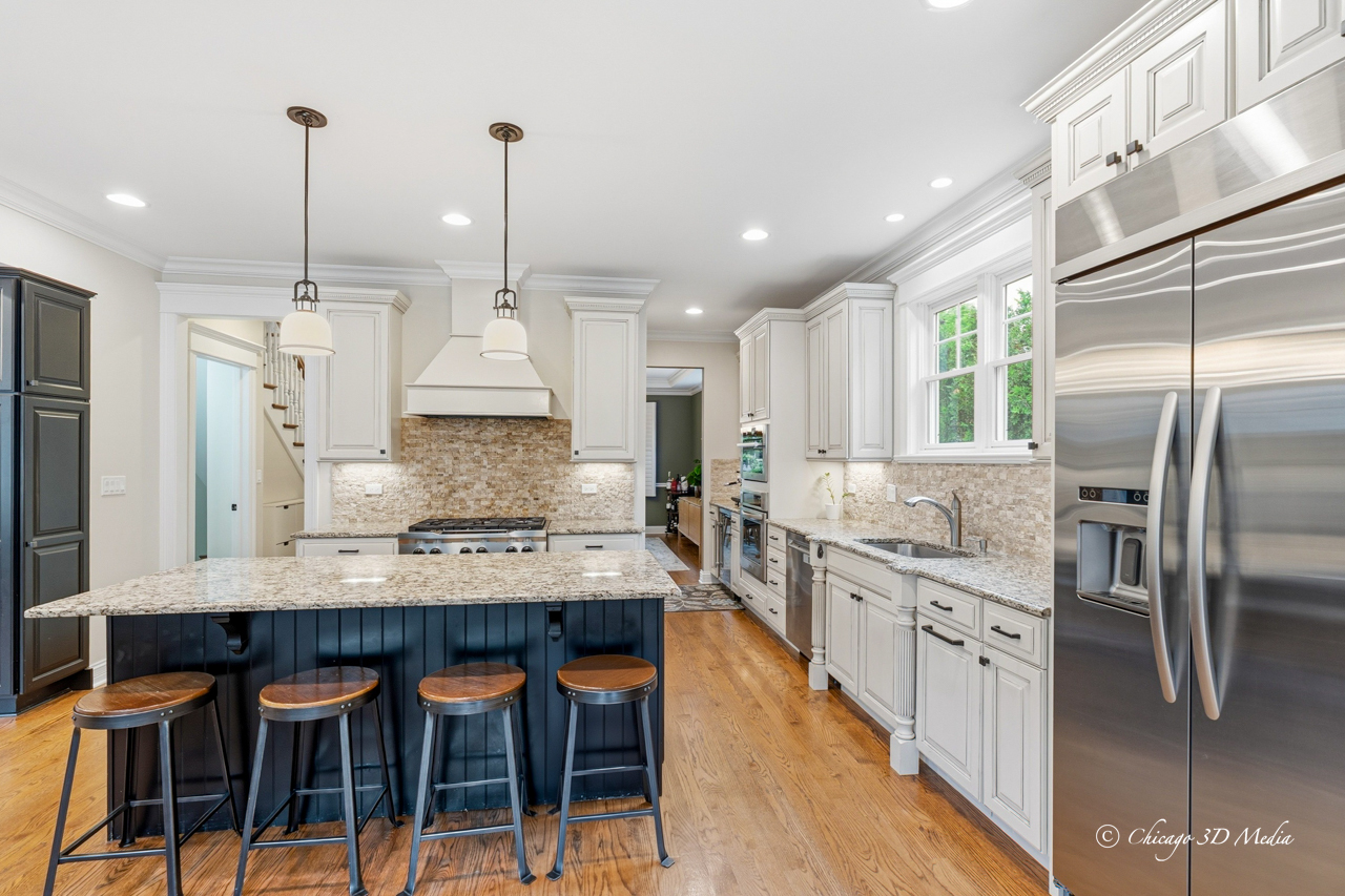 306 17th Street Wilmette, IL 60091 - Photo 17 of 48 a large kitchen with granite countertop lots of counter space and stainless steel appliances