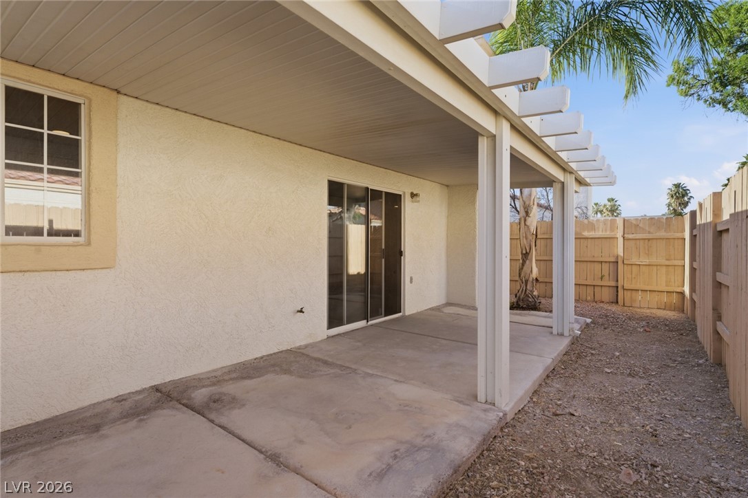 5449 Bugle Way, Unit 104 Las Vegas, NV 89108 - Photo 16 of 33 patio 1- This private backyard features a spacious patio perfect for outdoor enjoyment and entertaining.