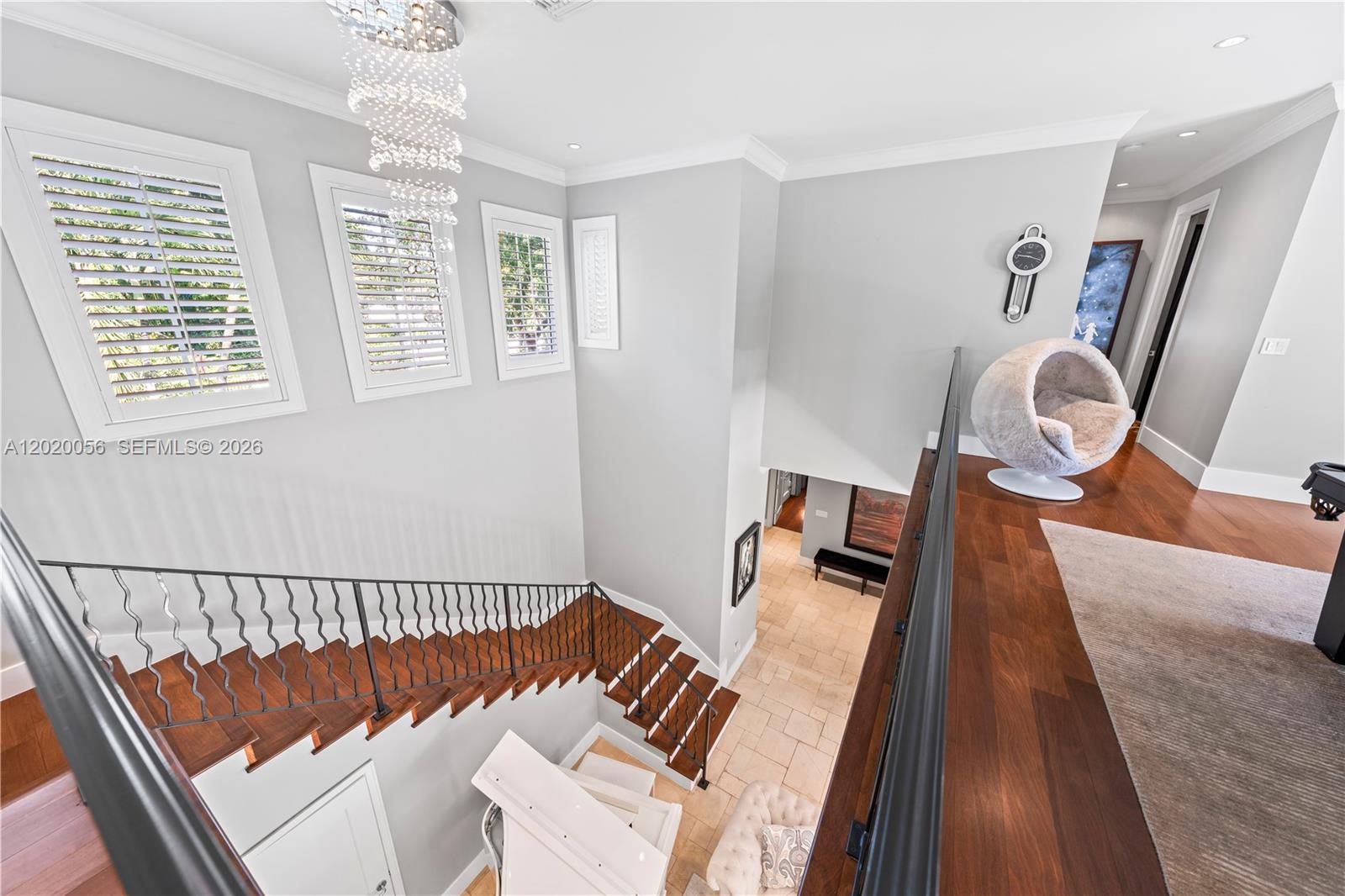 4196 Douglas Road Miami, FL 33133 - Photo 39 of 96 a view of a bedroom with wooden floor and windows