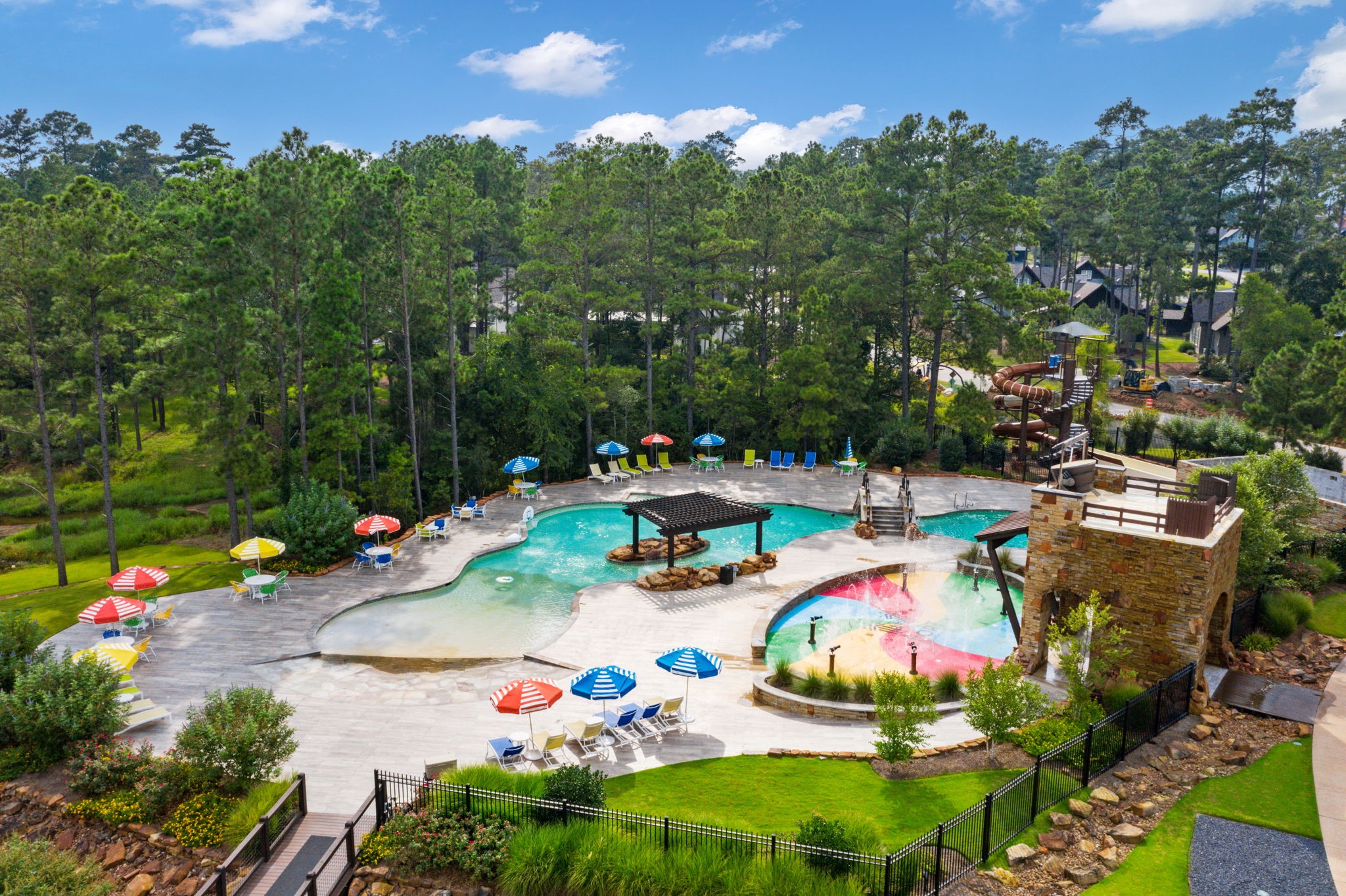 4463 Lily Bean Road Montgomery, TX 77316 - Photo 40 of 45 incredible water park featuring two swimming pools, including a lagoon pool and a 150-foot water slide!