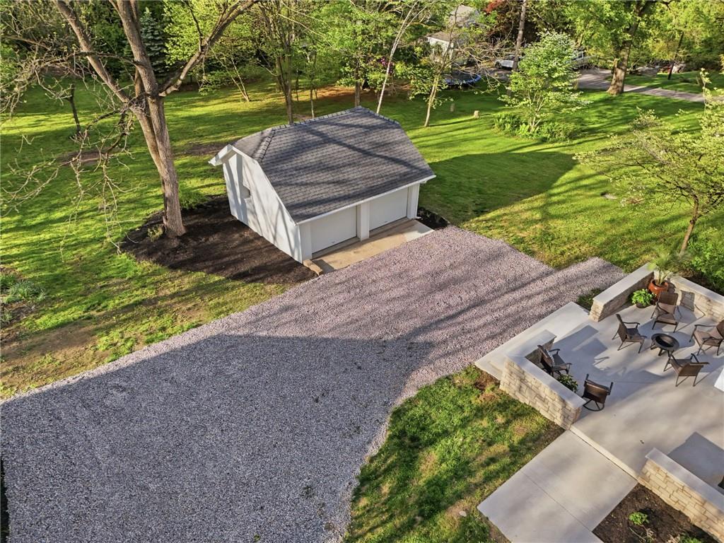 3944 Bakerstown Road Gibsonia, PA 15044 - Photo 49 of 50 a view of a backyard with lawn chairs under an umbrella