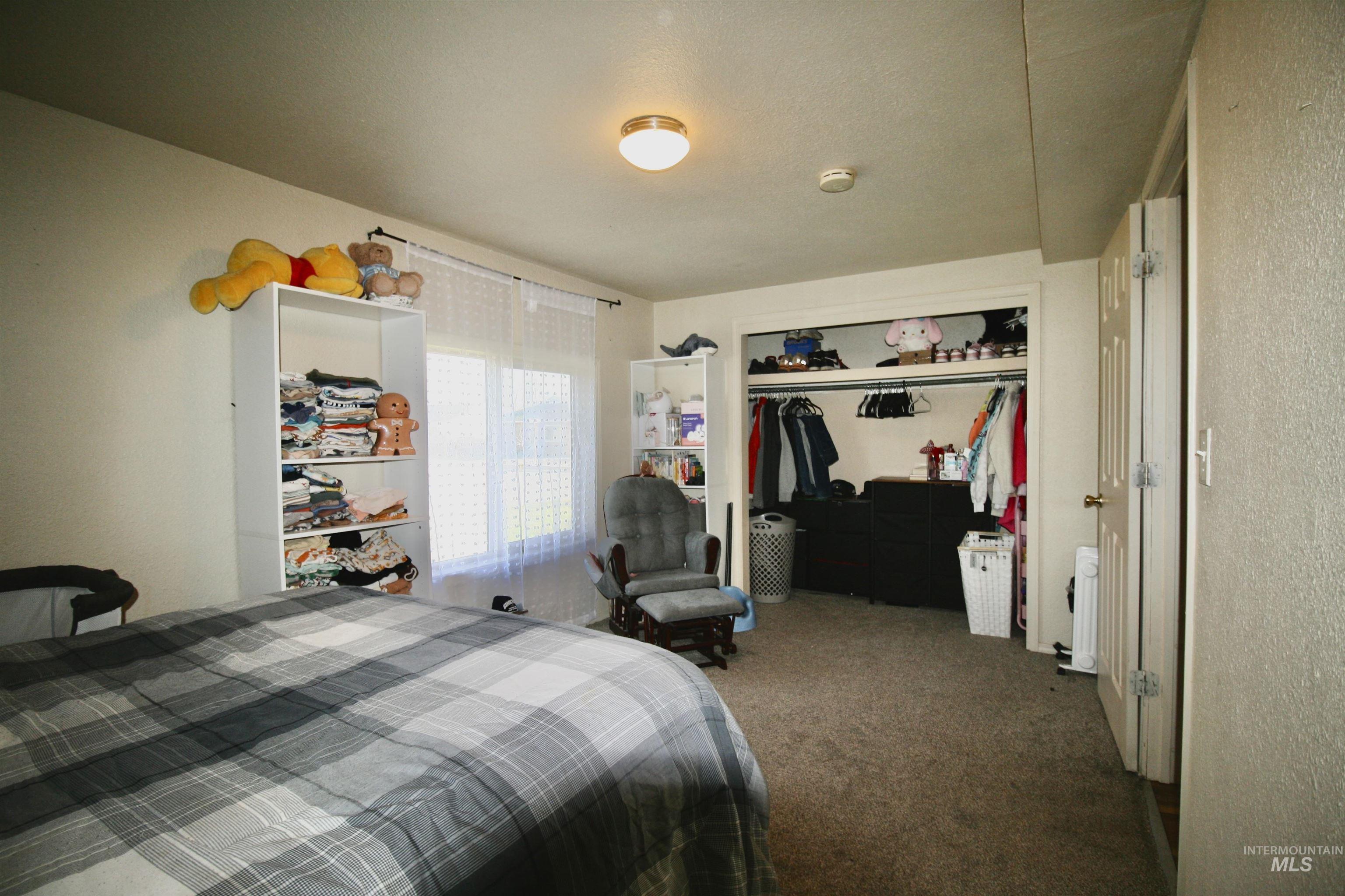 539 North 2nd Street Nyssa, OR 97913 - Photo 11 of 18 Bedroom featuring a closet and carpet
