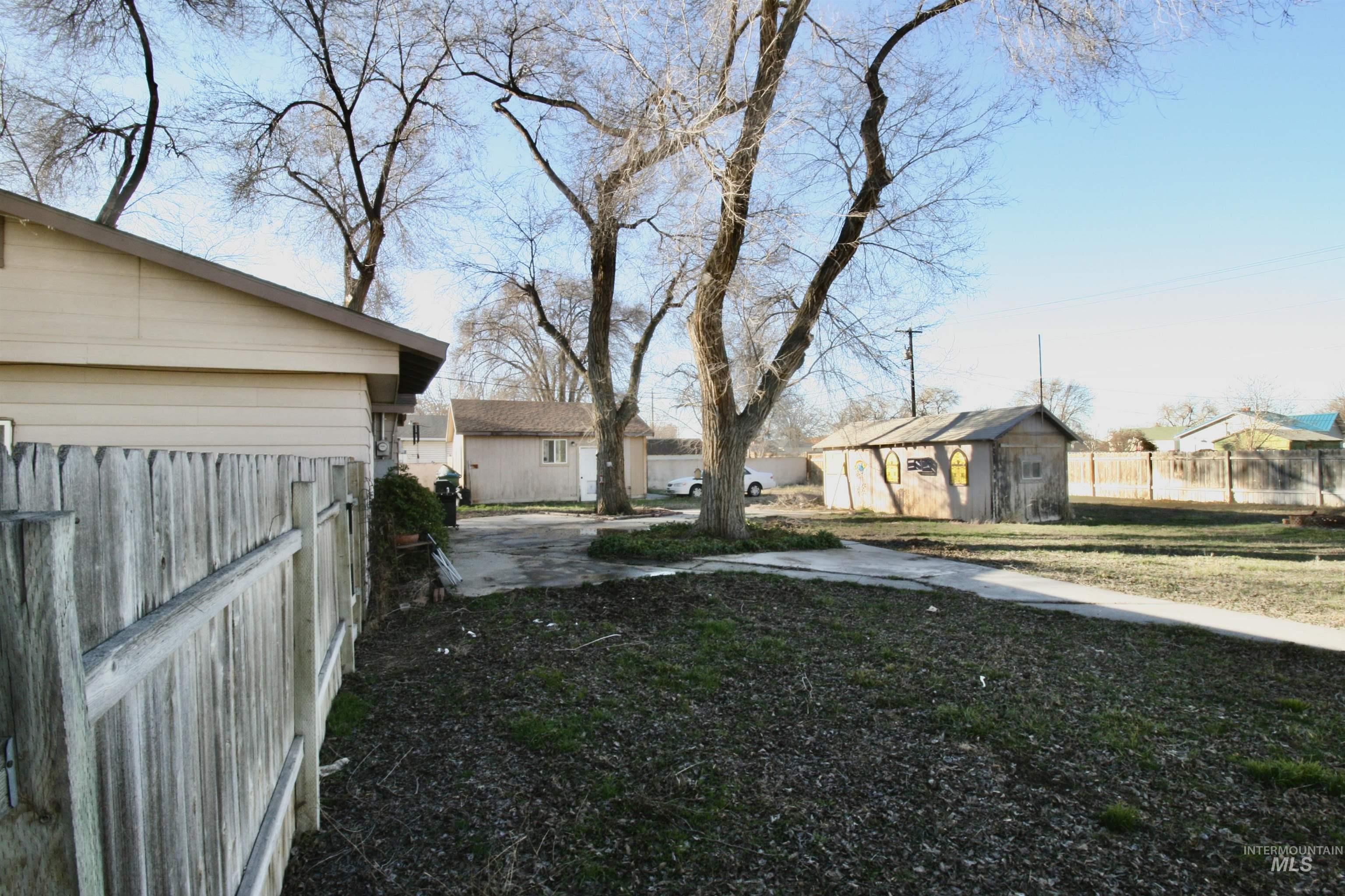 539 North 2nd Street Nyssa, OR 97913 - Photo 5 of 18 Fenced backyard with a residential view, a patio area, and a storage shed